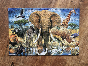 Picture of completed puzzle on wooden table.